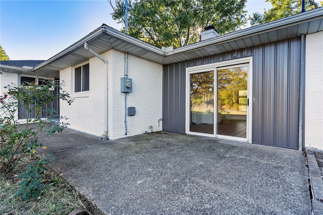 view of side of home featuring a patio area