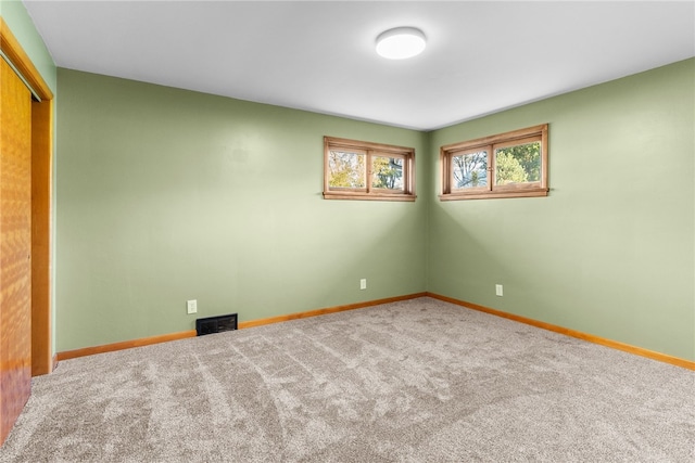 view of carpeted spare room