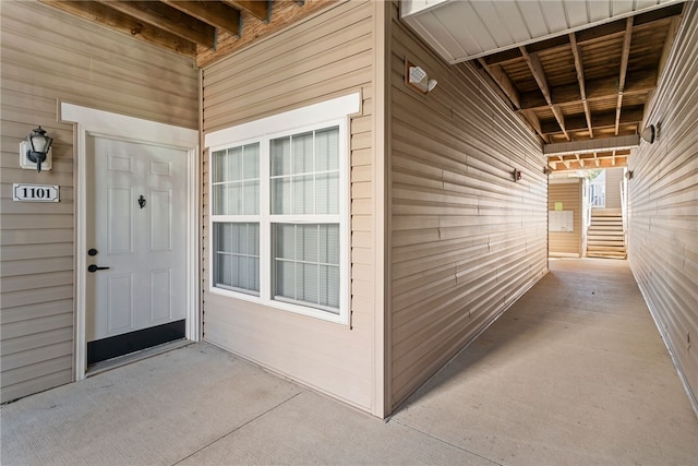 property entrance featuring a patio area