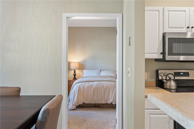 bedroom with light colored carpet