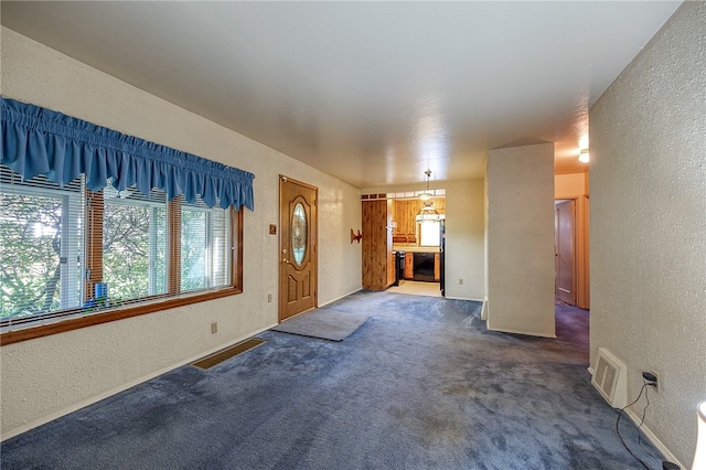 unfurnished living room with carpet flooring