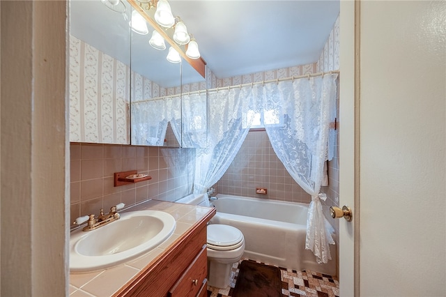 full bathroom with toilet, vanity, shower / bath combination with curtain, and tile walls