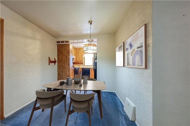 view of carpeted dining area