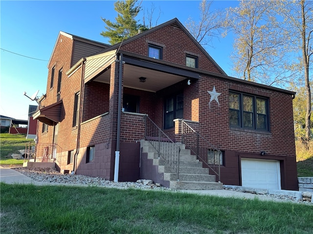 view of front of home featuring a garage and a front lawn