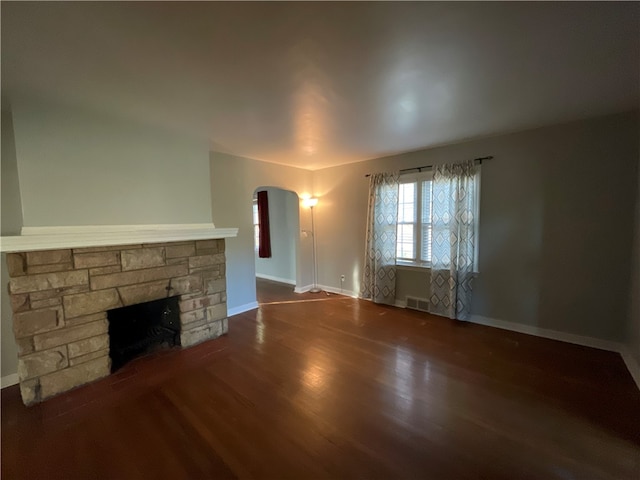 unfurnished living room featuring hardwood / wood-style floors and a fireplace