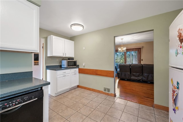 kitchen featuring light hardwood / wood-style floors, black dishwasher, white cabinets, and white fridge