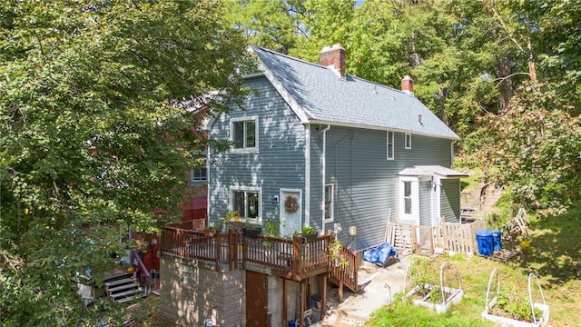 view of side of home with a wooden deck