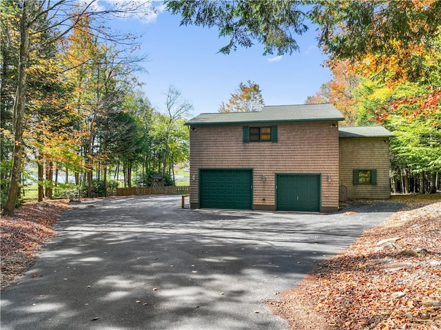 view of property exterior with a garage