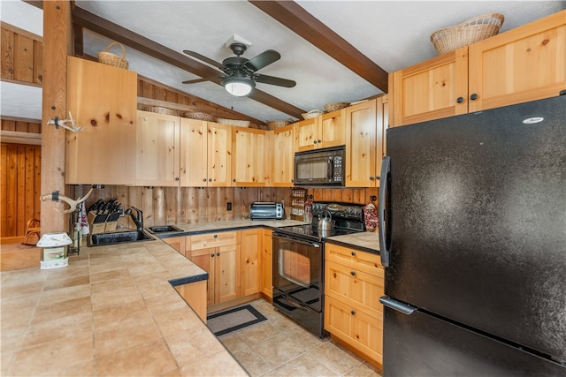 kitchen featuring light brown cabinets, black appliances, and tile counters