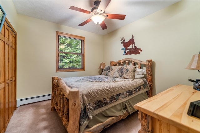 carpeted bedroom with ceiling fan, a closet, and baseboard heating