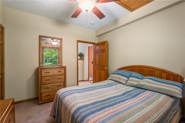 bedroom featuring ceiling fan and light carpet