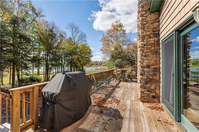 wooden deck featuring area for grilling