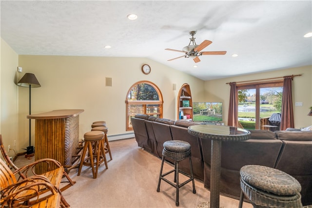 bar with lofted ceiling, ceiling fan, a baseboard heating unit, light colored carpet, and a textured ceiling