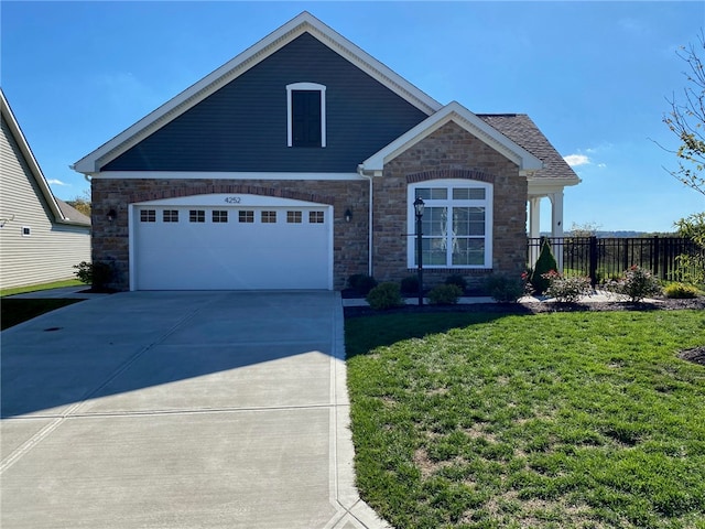 view of front of home featuring a garage and a front lawn