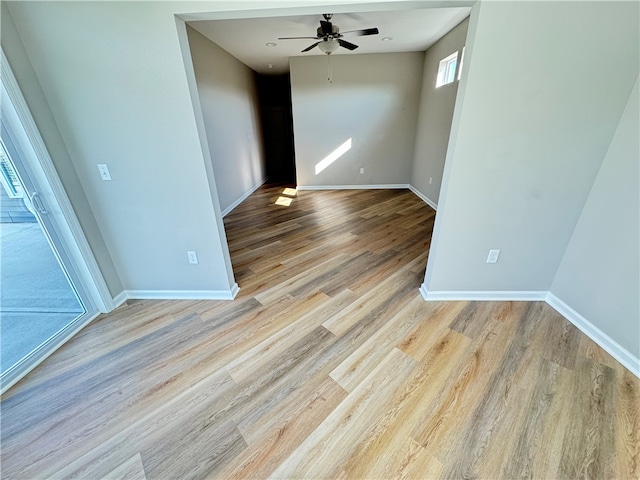 unfurnished room featuring light wood-type flooring and ceiling fan