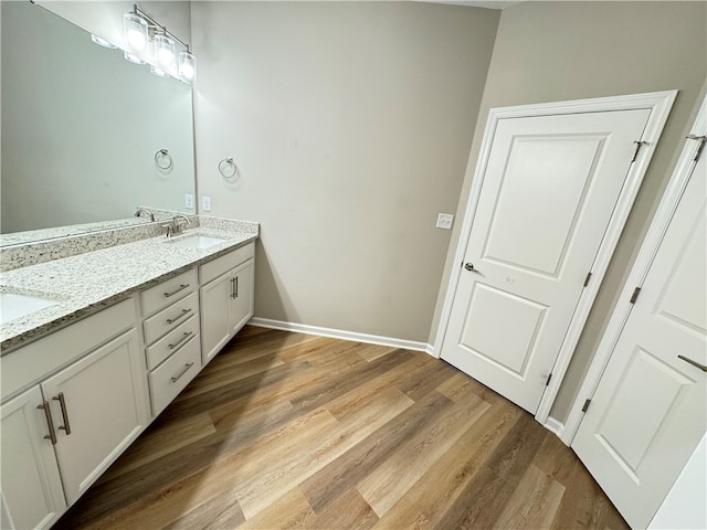 bathroom featuring vanity and hardwood / wood-style flooring