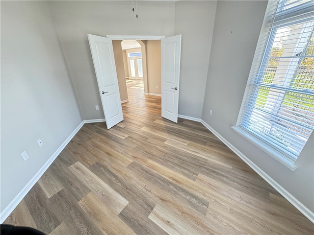 spare room featuring light hardwood / wood-style flooring