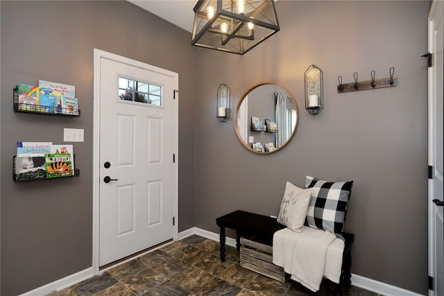 foyer with a chandelier