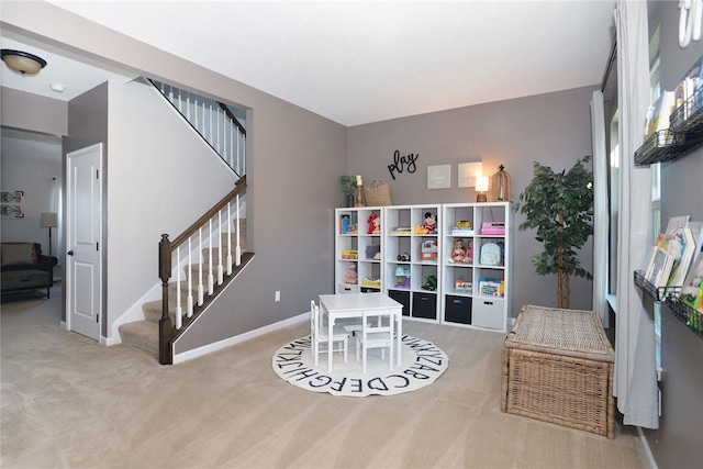 game room featuring light colored carpet