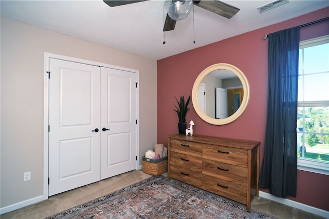 bedroom featuring carpet floors, a closet, and ceiling fan