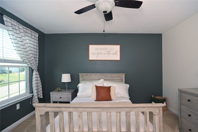 carpeted bedroom featuring ceiling fan