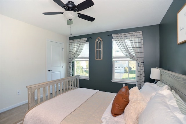 carpeted bedroom featuring ceiling fan