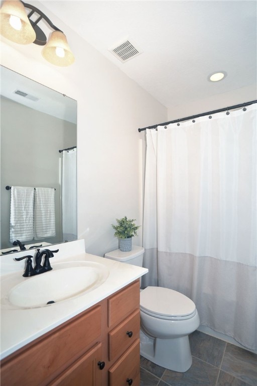 bathroom featuring vanity, tile patterned flooring, toilet, and a shower with shower curtain