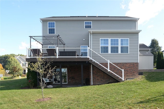 rear view of property with a wooden deck and a lawn