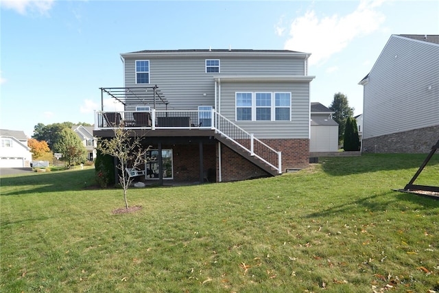 back of property featuring a yard and a deck