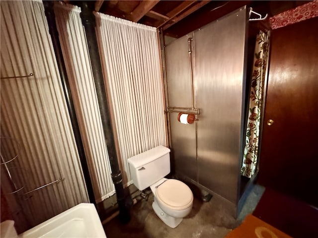 bathroom featuring concrete floors, shower with separate bathtub, and toilet