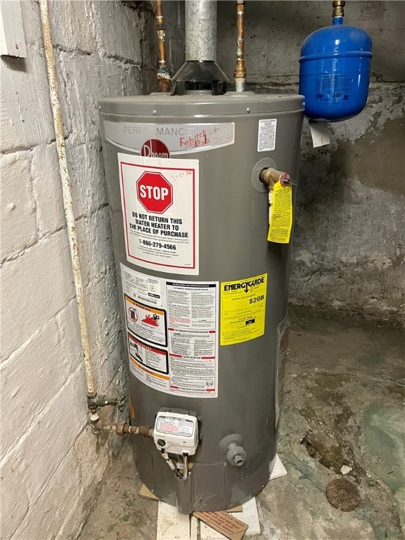 utility room featuring water heater