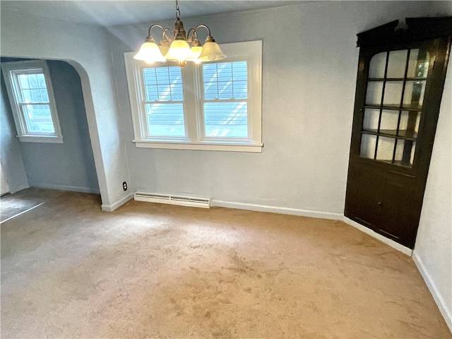 unfurnished dining area with a baseboard radiator, an inviting chandelier, and carpet flooring