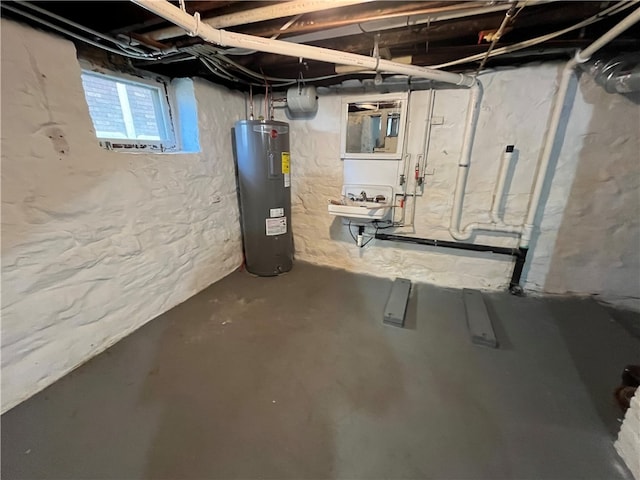 basement featuring electric water heater