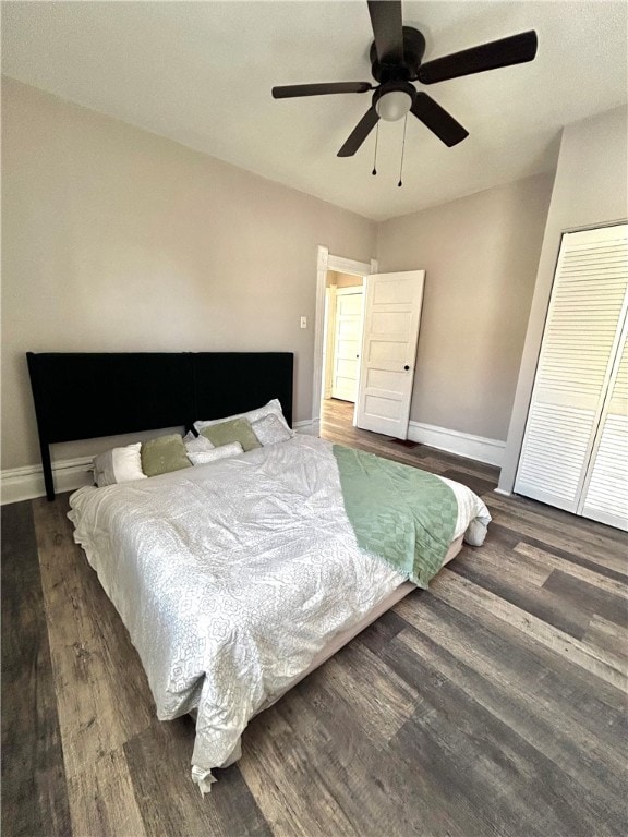 bedroom featuring ceiling fan and dark hardwood / wood-style floors