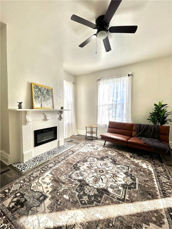 living room featuring hardwood / wood-style flooring and ceiling fan