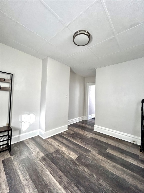 empty room with dark wood-type flooring