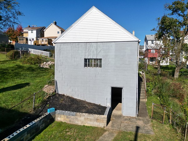 view of outbuilding with a yard