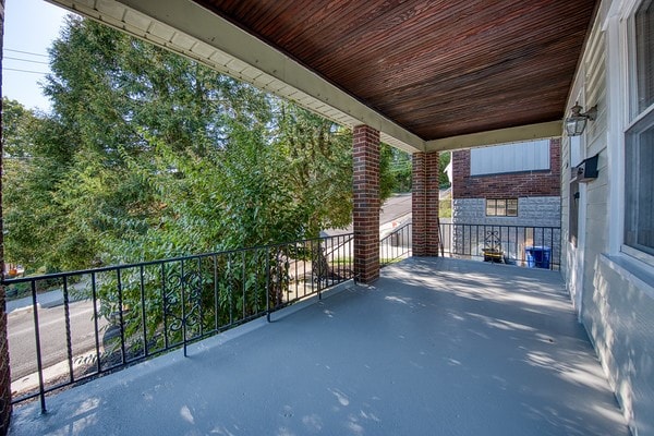 view of patio featuring a balcony