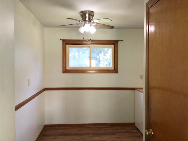 spare room featuring ceiling fan and dark hardwood / wood-style floors