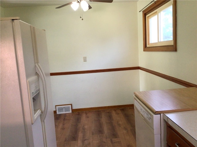 kitchen featuring ceiling fan, dark wood-type flooring, and white appliances