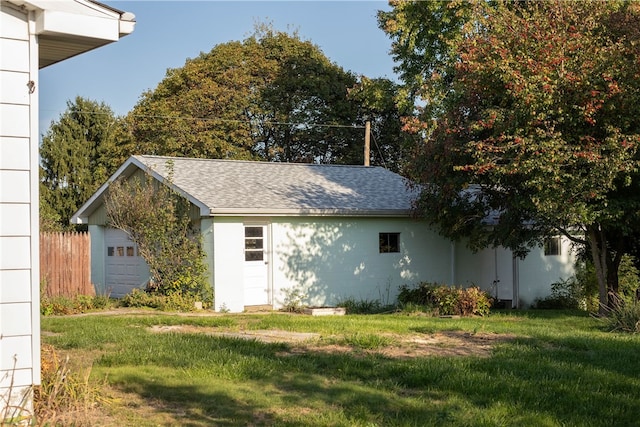 view of side of home featuring a lawn