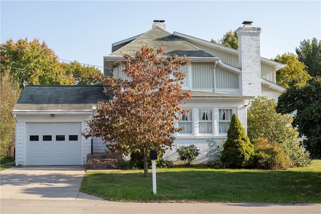 view of front of house featuring a garage and a front yard