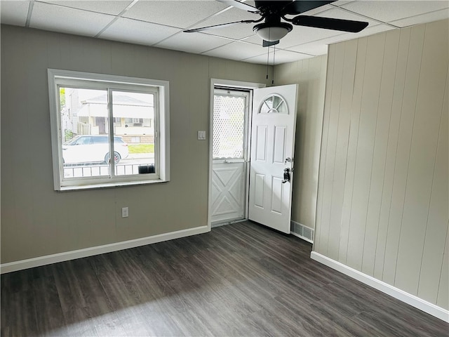 entryway featuring ceiling fan, dark hardwood / wood-style flooring, and a drop ceiling