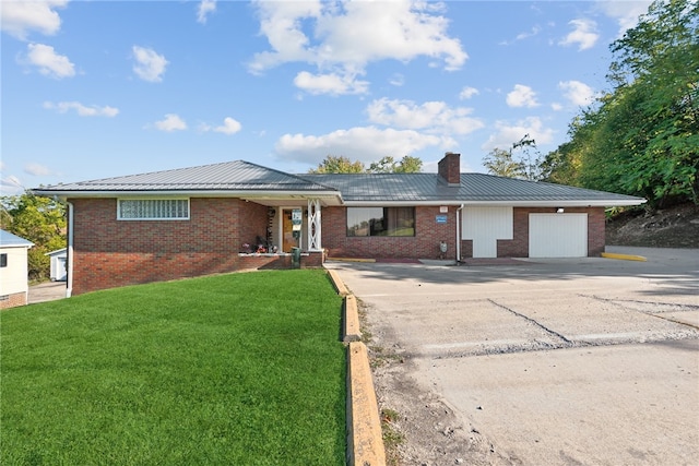 ranch-style home featuring a garage and a front yard