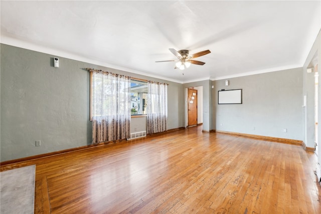 unfurnished room with ornamental molding, ceiling fan, and light hardwood / wood-style floors