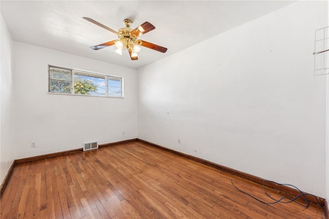 unfurnished room featuring ceiling fan and hardwood / wood-style floors