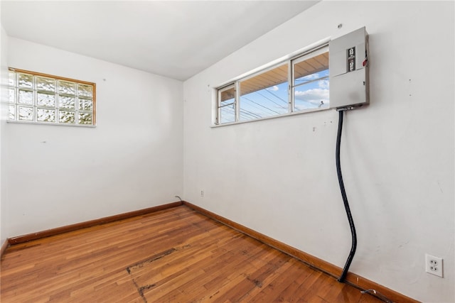 unfurnished room featuring hardwood / wood-style floors