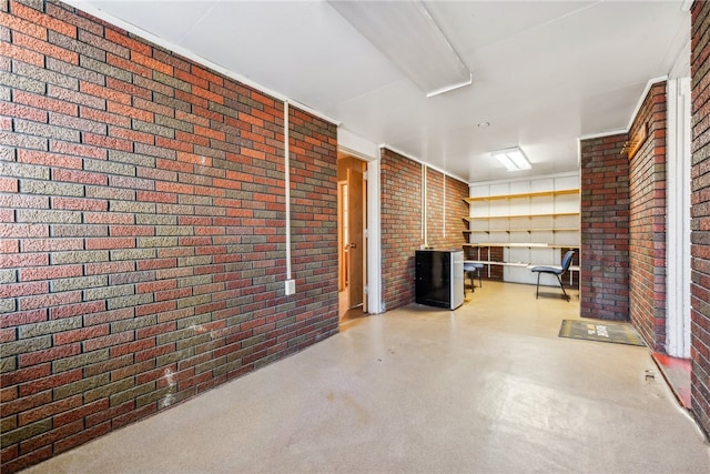 basement with brick wall