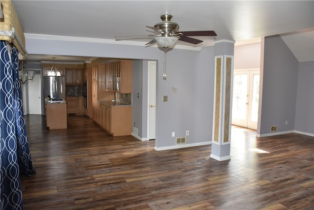 kitchen with backsplash, stainless steel refrigerator, dark hardwood / wood-style flooring, and crown molding