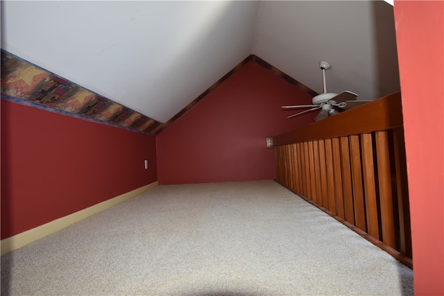 additional living space with carpet floors, lofted ceiling, and ceiling fan